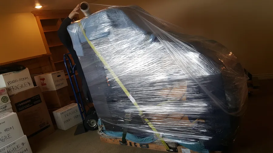 A piano in transit during a 2016 Safe and Sound Pianos job.