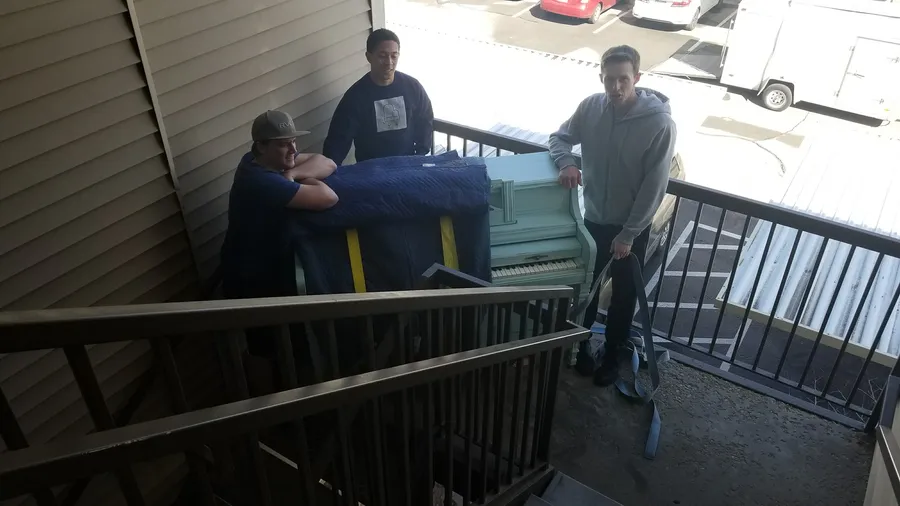A wrapped piano at a customer location during a Safe and Sound Pianos move.