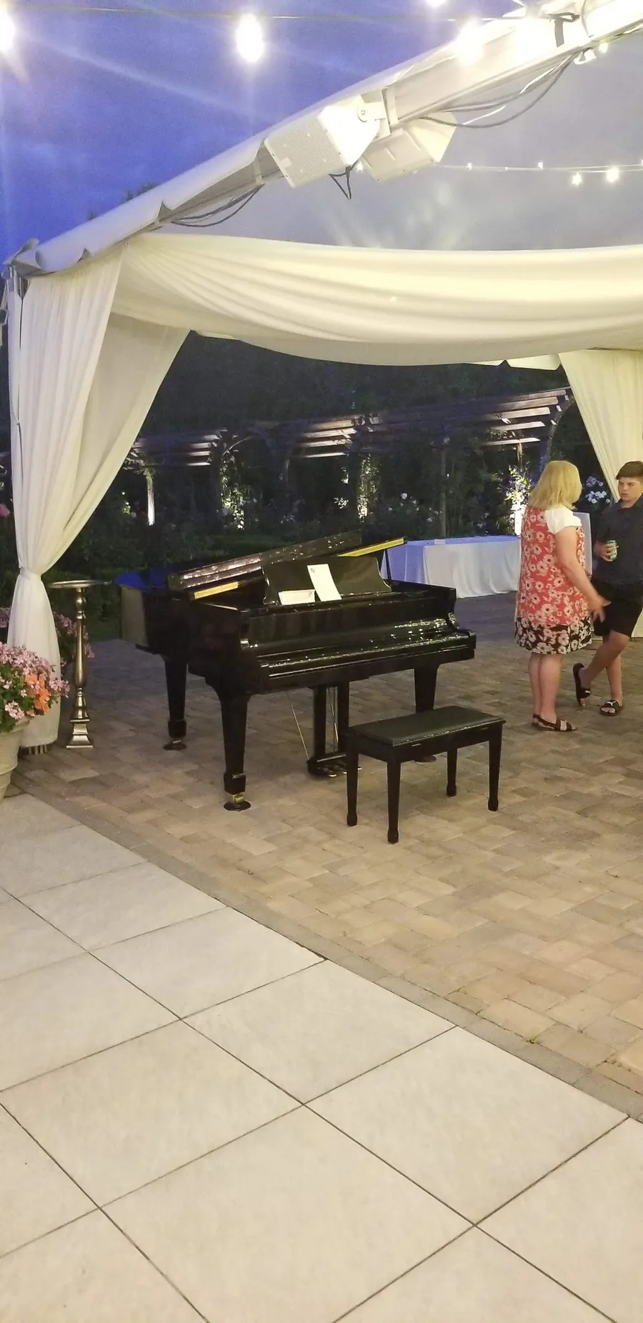 Safe and Sound Pianos team handling a piano during a delivery.