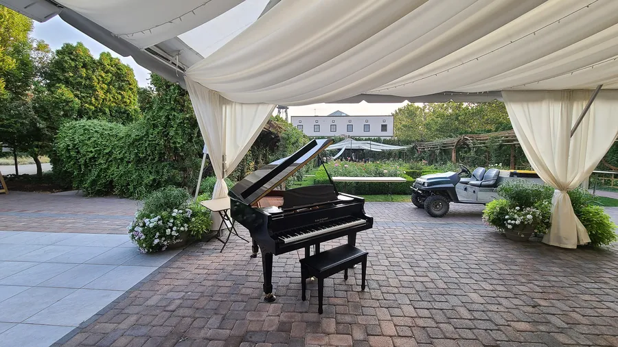 Safe and Sound Pianos crew handling a piano move at a Utah residence.