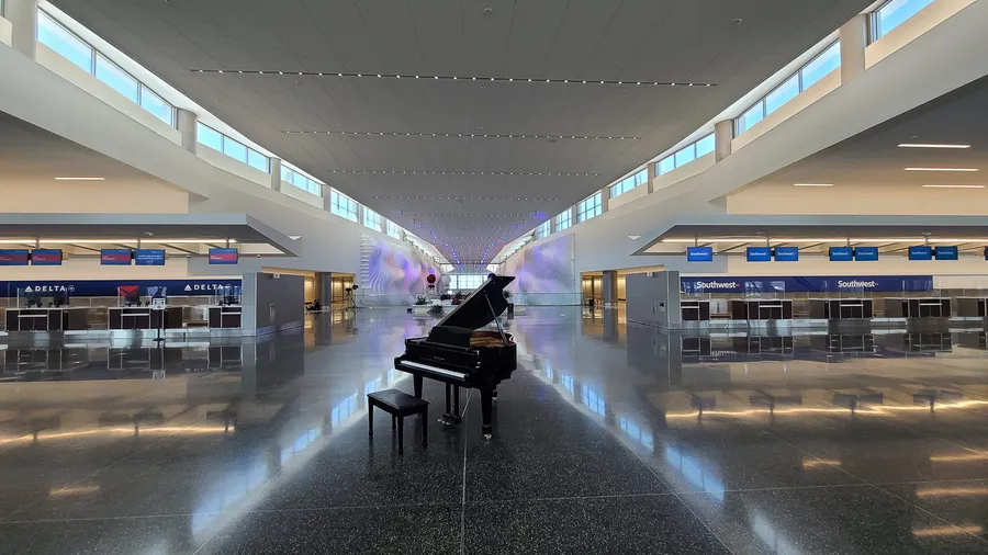 Salt Lake City International Airport opening — a black grand piano placed in the new terminal hall.