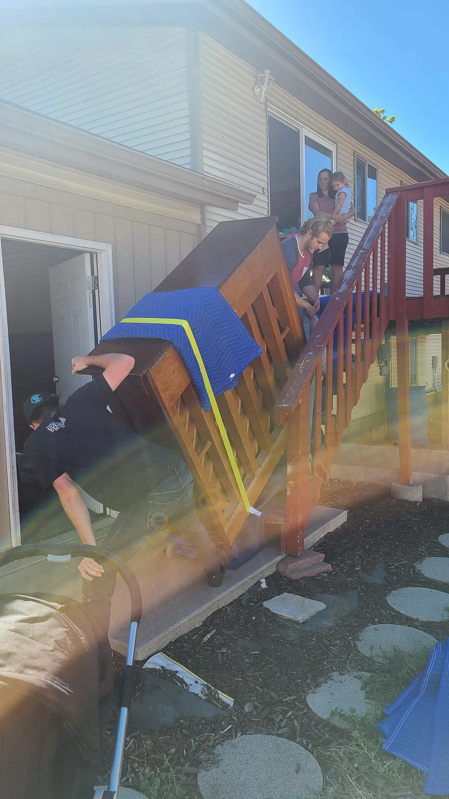 Wrapped piano staged for transport during a fall 2020 Salt Lake Valley move.
