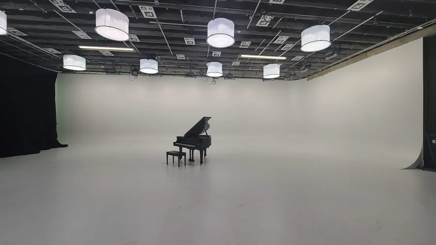 Crew handling a wrapped piano at a Utah location during a late-2020 move.